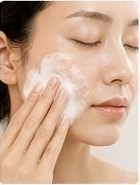 Scrubbing face with foaming cleanser